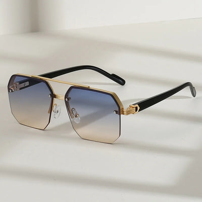 Lunettes de soleil Glassy Mood au design hexagonal avec monture dorée et verres dégradés bleus