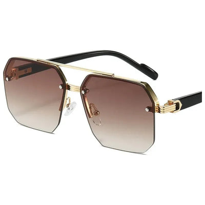 Lunettes de soleil Glassy Mood style hexagonal avec monture dorée et verres dégradés marron