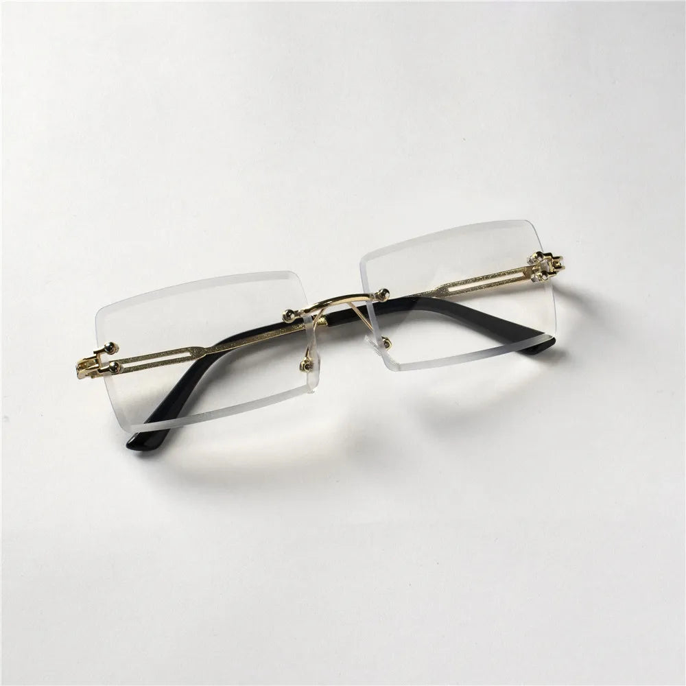 Lunettes de soleil tendance Berlin sans monture avec branches noires et détails dorés signées Glassy Mood