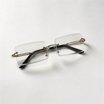 Lunettes de soleil tendance Berlin sans monture avec branches noires et détails dorés signées Glassy Mood