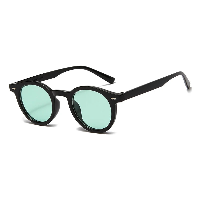 Lunettes de soleil Glassy Mood avec monture noire ronde et verres teintés verts